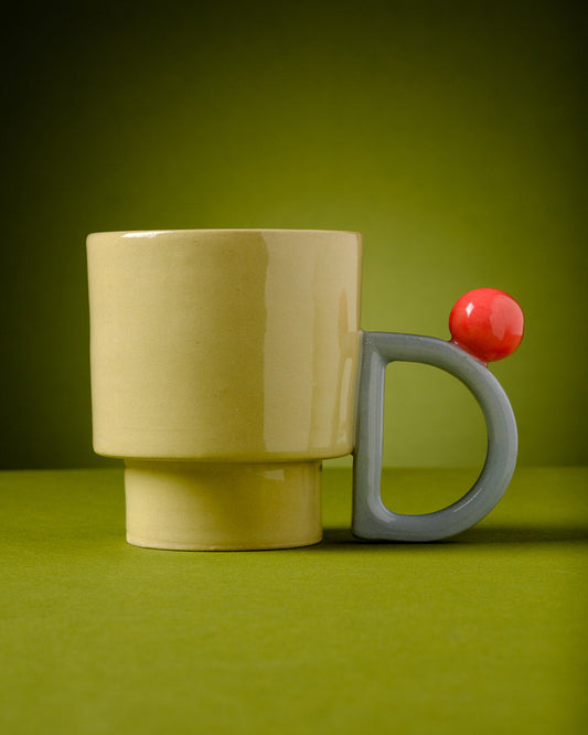 Daniella Mug - ABS Objects - Modern Handmade Judaica from the Holy Land. Handmade ceramic mug with postmodern design and playful colors. Sculptural coffee cup crafted in Tel Aviv from stoneware, featuring a bold handle and artistic form. Contemporary Israeli ceramics.