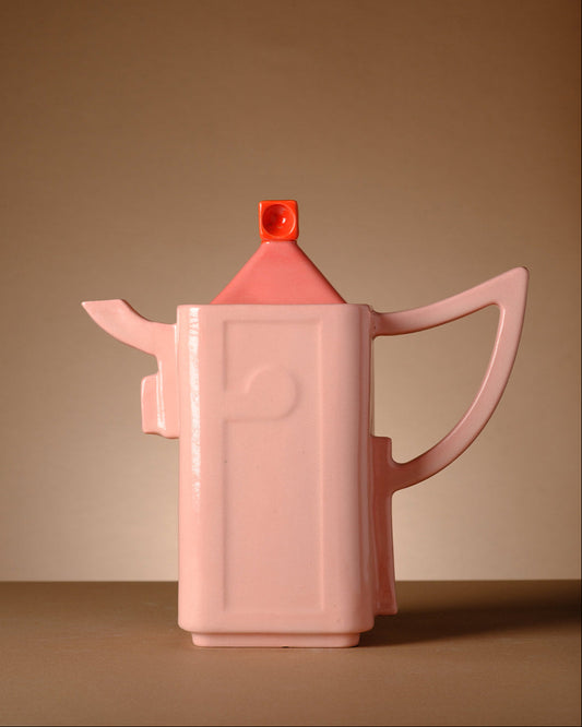 Modern handmade ceramic coffee pitcher with sculpted Hebrew letters spelling “Kafe” (קפה), inspired by Tel Aviv architecture and Israeli design aesthetics. Contemporary Judaica and minimalist stoneware object.