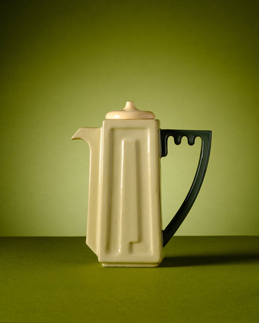 Shemen – Olive Oil Pitcher - Modern Handmade Judaica by ABS Objects. Hand Made in the Holy Land. Luxury handcrafted ceramic olive oil pitcher featuring sculpted Hebrew typography spelling “Shemen” (שמן). Inspired by Israeli Brutalist architecture and the Shrine of the Book in Jerusalem. Designed in Tel Aviv. Modern Judaica, minimalist Israeli design, Hebrew letterform homeware.