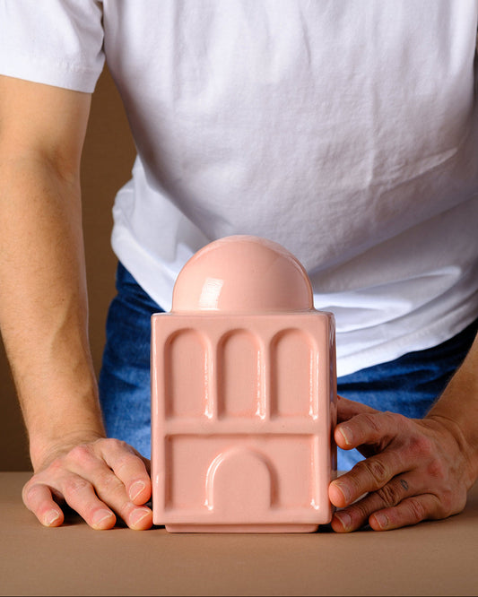 modern Judaica Tzedakah Box design 
Modern handcrafted Tzedakah box inspired by Hebrew typography and Rachel’s Tomb architecture, designed in Tel Aviv. Contemporary Judaica object in blush ceramic, featuring sculptural letters ש and ח.