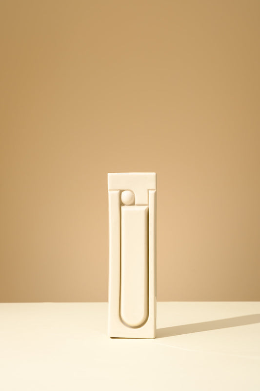 Handmade ceramic mezuzah in glossy olive green glaze, featuring a minimalist geometric relief design, crafted in Israel