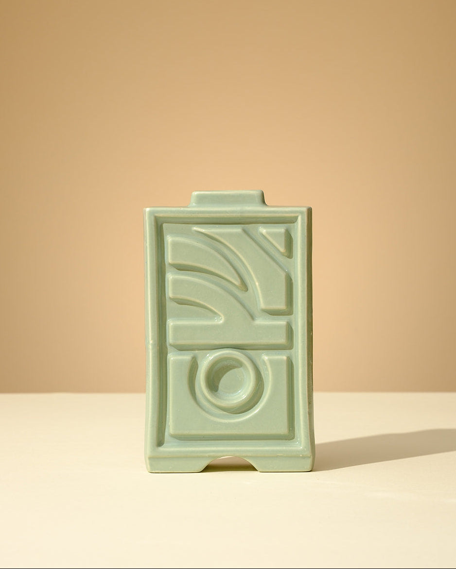 Handmade ceramic Judaica object in soft mint green glaze with geometric relief details
