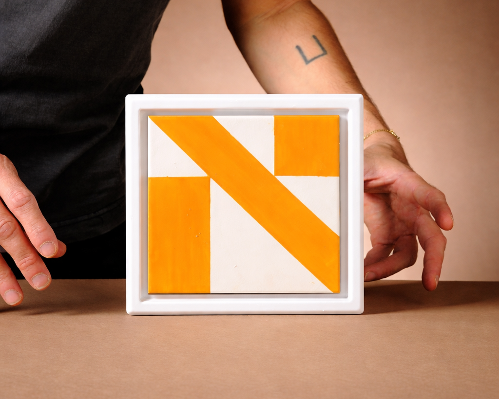 Framed Letter Tiles – The Hebrew Alphabet - Modern Judaica Handmade in Tel Aviv by ABS Objects. Handmade ceramic Hebrew letter tiles framed in stoneware, hand-painted in Tel Aviv. Personalized wall decor for children’s rooms, modern nursery design, or custom home signage. Inspired by Hebrew modernist typography and Israeli visual culture.

