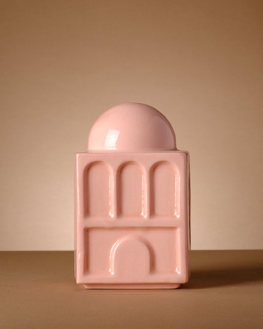 modern Judaica Tzedakah Box design 
Modern handcrafted Tzedakah box inspired by Hebrew typography and Rachel’s Tomb architecture, designed in Tel Aviv. Contemporary Judaica object in blush ceramic, featuring sculptural letters ש and ח.